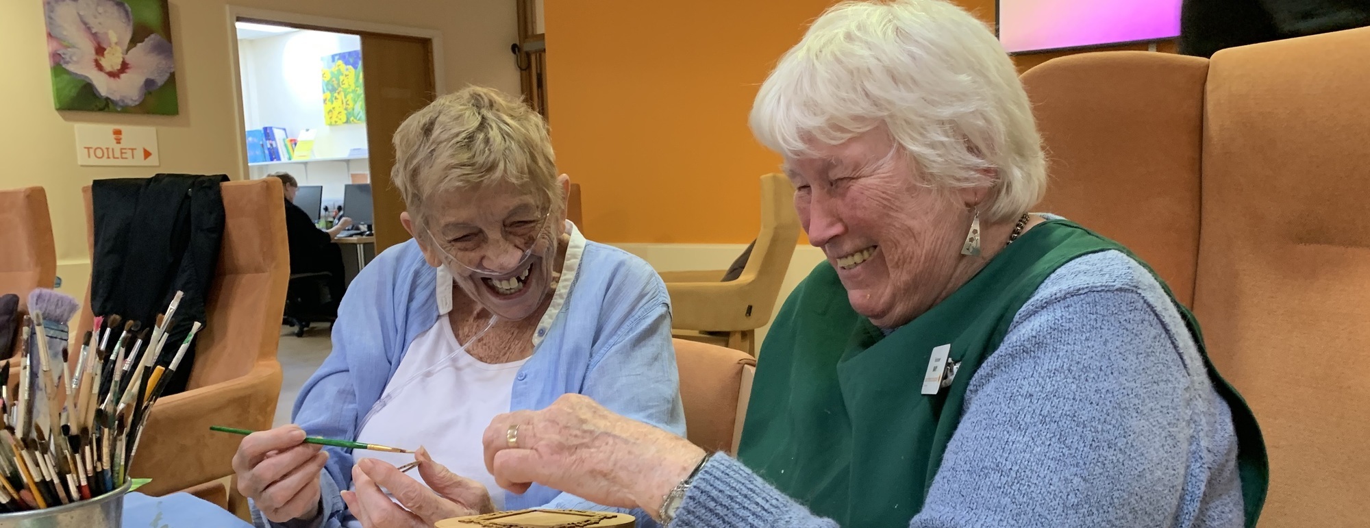 Volunteer Mary and patient Christine Smith share a laugh cropped